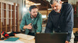 © FremeFlex/peopleimages.com - Laptop, teamwork or people in woodworking factory for warehouse inventory, carpentry or furniture production. Research, carpenter or project update for timber, lumber supply or construction business