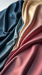 Poster - The image displays three different colored fabrics, each with a unique hue. The blue fabric is positioned on the left side of the image, while the pink fabric is situated in the middle