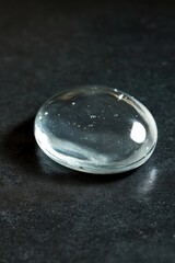 Poster - A close-up of a glass object sitting on a table, suitable for use in various settings such as product photography or decorative displays