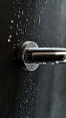 Poster - A close-up shot of a door handle covered in water, perfect for use in scenes where moisture is involved