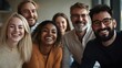 © HISTOCK - Happy diverse business team smiling together in the office