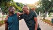 © peopleimages.com - Fitness, friends and men with laugh, hug or hello outdoor for wellness. Smile, greeting and African athlete together for meeting, team training or embrace for reunion at sports park for exercise