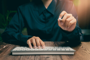 Poster - Focused Business Professional Using Keyboard with a Stylus in Modern Workspace Environment, Business concept