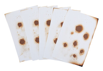 Aufkleber - Collection of burnt holes appearing in a piece of paper set against a white background
