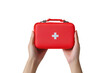 © SekhSadi - A hand holding a red first aid kit isolated on white background PNG. AI GENERATED