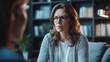 © Roman - Concerned caucasian female adult with glasses in thoughtful discussion