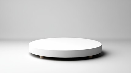 Poster - Minimalist low circular white pedestal with light brown wooden legs set against a plain white background perfect for modern interior design aesthetics