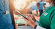 © peopleimages.com - Hands, tablet and volunteers for charity, help and review of donations on website or discussion. Social responsibility, closeup and people in warehouse with supplies for community service or NGO team