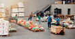 © Jess B/peopleimages.com - People, volunteer and help with food distribution for grocery donation, sorting vegetables and charity aid. Staff, packaging stock and community outreach, social responsibility and non profit program