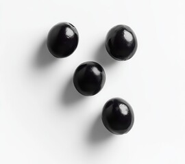 Poster - Glossy Black Orbs on White Surface with Dramatic Shadows for Stylish Modern Interiors and Artistic Promotions – Perfect for Creative Projects
