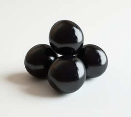 Poster - Smooth black spheres stacked in an artistic arrangement on a neutral background showcasing modern minimalism and contemporary design elements