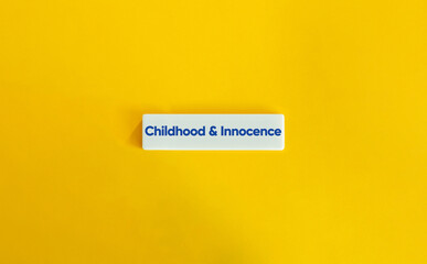 Wall Mural - childhood and innocence banner. text on block letter tile on yellow background. minimal aesthetic.
