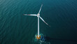 © Viktor - Aerial view of offshore wind turbine farm. Modern wind power generator in ocean. Eco energy, clean, sustainable source of electricity. Renewable green power tech. Turbine blades rotate, create