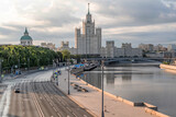 Moscow Stalinist skyscraper on Kotelnicheskaya embankment dominates the skyline, blending Soviet grandeur with historical cityscapes along the Moscow River reflective waters