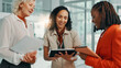 © FremeFlex/peopleimages.com - Documents, smile and tablet with business women in lobby of office for planning or strategy. Collaboration, proposal or report with boss and happy employee team in workplace for feedback or review