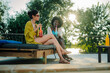 © Zamrznuti tonovi - Two young women relaxing by the pool, enjoying summer cocktails and conversation