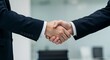 © ahmed elmaslamani - Business handshake symbolizing agreement partnership and success in an office