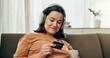 © peopleimages.com - Home, headphones and woman credit card, smile and thinking of update of streaming app, online or lounge. Relax, listen and person with tech for playlist, happy or decision to pay membership for music