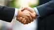 © songpol152 - Handshake between business partners sealing a successful deal, symbolizing trust and cooperation.