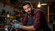 © Thipphaphone - A skilled mechanic intently focused on restoring a classic motorcycle in the comfort of his own workshop