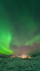 Wall Mural - Vertical View Of Dramatic Sky With Aurora Borealis Near Kvaloyvaagen, Norway. Timelapse