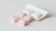 © Lush Diaries - Pink and white chewable tablets, a refreshing treat.
