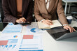 © NINENII - Businessmen team or financial data analysts working with tablets and laptop computers and data graphs together. Plan to analyzing projects in the office..