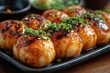 © zong - Delicious Takoyaki Octopus Snacks with Green Onions and Savory Sauce