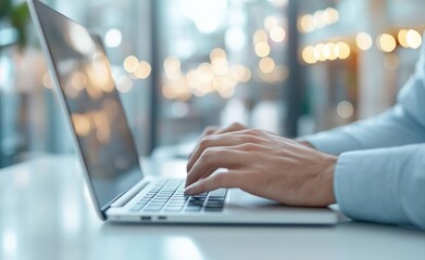 Poster - Businessman typing on laptop in modern office with large windows