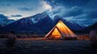© Riyan - Illuminated tent under starry sky, majestic mountains