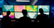 © DavidL25/peopleimages.com - Weather, screen or monitor with people for forecast, satellite maps or teamwork to track storm. Control room, back or scientists with meteorology for broadcast news, report or silhouette at night