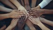 © Muhammad - Multiple hands from diverse individuals coming together in unity, symbolizing teamwork, collaboration, inclusivity, and collective effort.