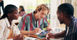 © peopleimages.com - Teamwork, students or people on tablet for university exam in class with information, research or education. Studying, writing or project in college with school, technology or discussion for learning