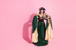 © deagreez - Medieval-inspired woman in elegant attire posing against vibrant pink backdrop showcasing cultural and historical charm