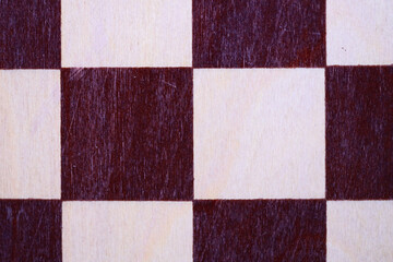 Poster - A detailed view of a chessboard featuring a red and white checkered pattern.