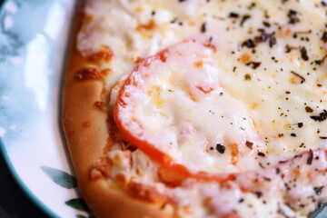 Poster - A close-up shot of a delicious-looking pizza on a plate, perfect for food or travel photography.