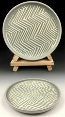 Wall Mural - Grey zig-zag patterned ceramic plate on wooden stand, studio shot, home d?cor, website product image