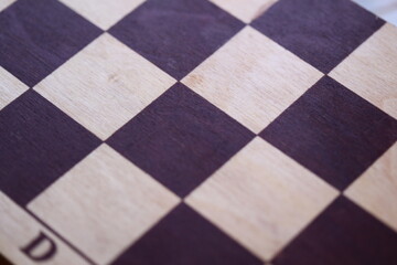 Poster - A close-up shot of a chess board featuring a classic checkerboard pattern.
