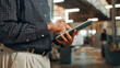 © FremeFlex/peopleimages.com - Hands, man and carpenter with tablet for woodwork, manufacturing and furniture production. Carpentry, person and digital technology in factory for construction, building and check warehouse inventory