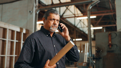 Aufkleber - Business, phone call and man in factory, stress and pressure with deadline for woodwork project. Mature person, employee and contractor in workshop, cellphone and mistake with building application