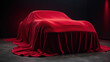 © Jari.art - sleek car covered in luxurious red fabric, creating air of mystery and anticipation. smooth draping enhances its elegant shape