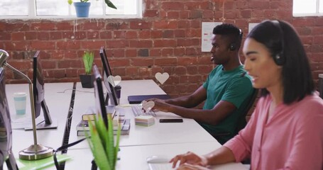 Poster - People working at office desks with floating heart icons animation