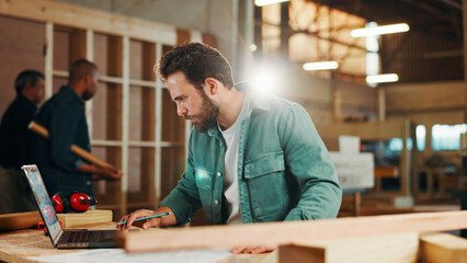 Poster - carpenter, laptop and research with wood to measure for construction, furniture or project. woodwork