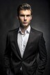© MSTSHAMALA - Young Businessman in Black Suit and White Shirt. Professional Portrait. Ambitious Businessman in Formal Attire.