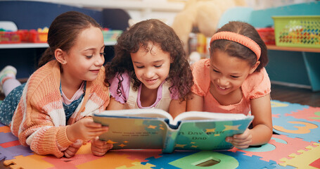 Poster - Girls, reading and friends on carpet, school and learning with education, smile and bonding together. Group, storytelling and kids in classroom, literacy knowledge or happiness with child development