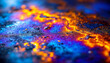 © ENDRY - Abstract iridescent oil slick surface with vibrant blue and gold patterns