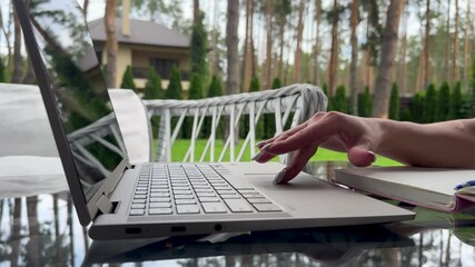Close up of freelancer's developer hands typing program code on laptop keyboard in coworking. Copywriter writing text on computer keyboard. Female Hands Typing on Laptop Keyboard Close Up