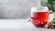 © Kaminashi Nozomi - Cozy winter herbal tea in a transparent mug.  Aromatic, warm, and festive beverage.  Red berries and spices create a delightful winter drink