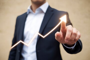 Poster - A businessman in a suit pointing at a glowing rising arrow graph, symbolizing financial growth, success, and positive business performance.