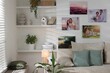 © New Africa - Canvas with different printed photos on white wall indoors